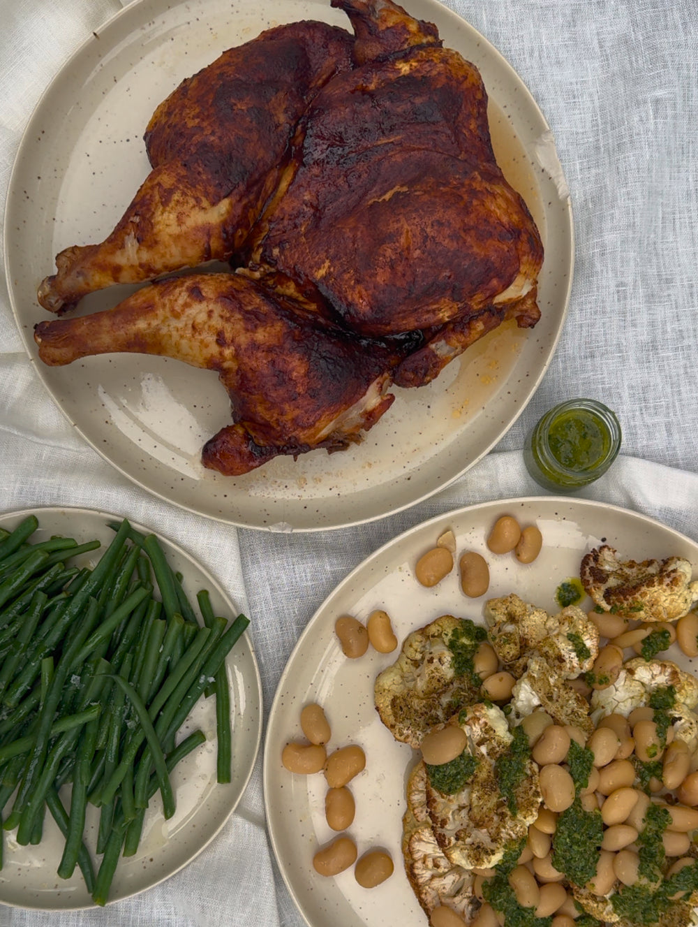 BBQ Spatchcock Chicken with Roasted Cauliflower, Butter Beans + Salsa Verde